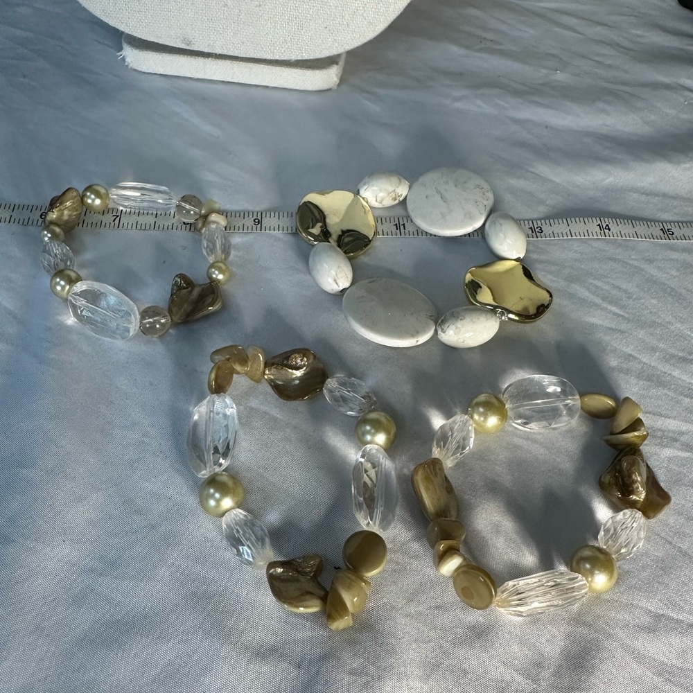Four older bead and shell stretch style bracelets